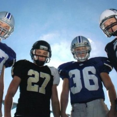 Woodason brothers where their football jerseys and helmets.