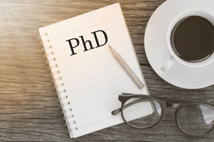 doctor of philosophy message on notebook