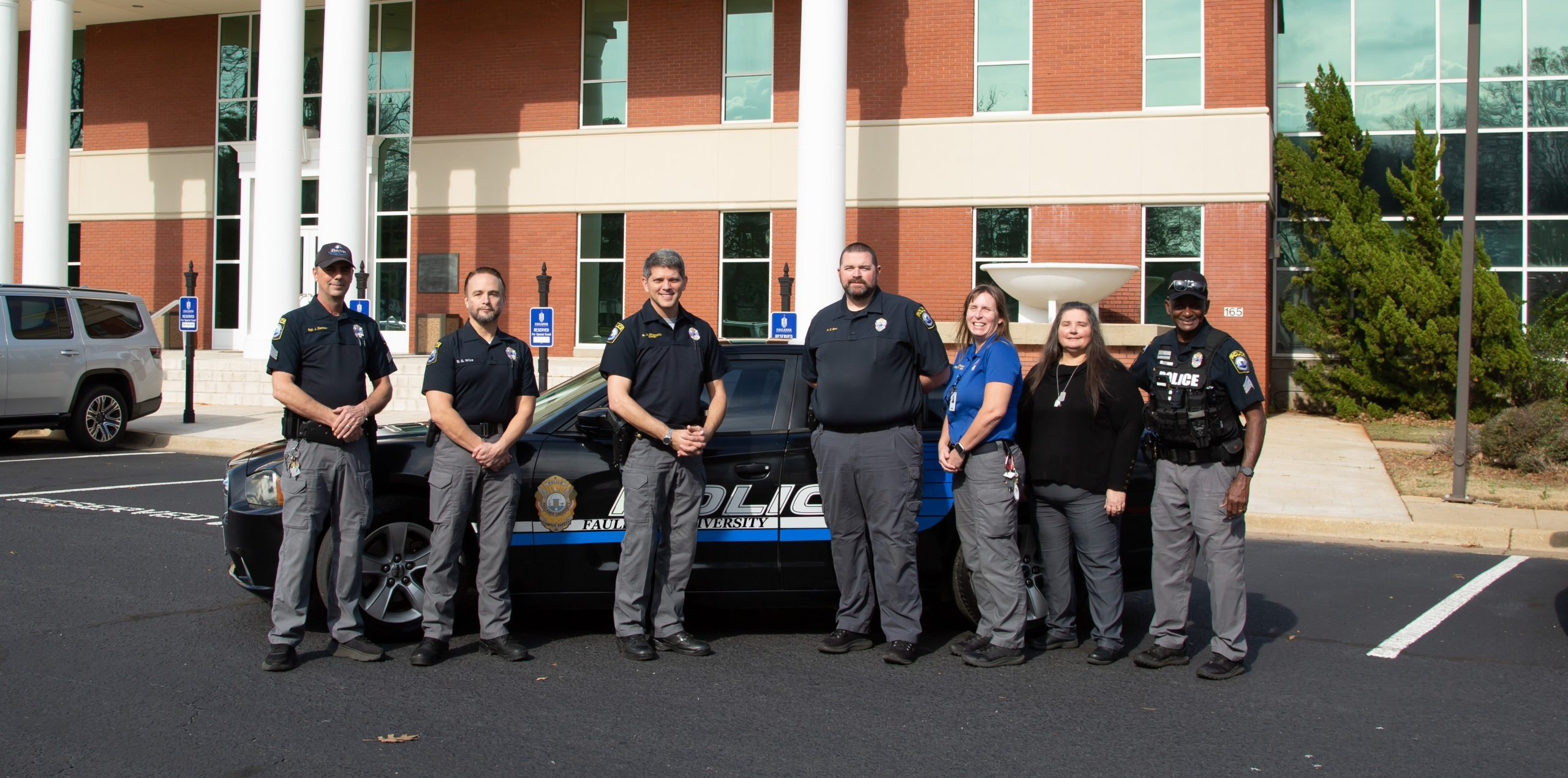 Faulkner police in front of car
