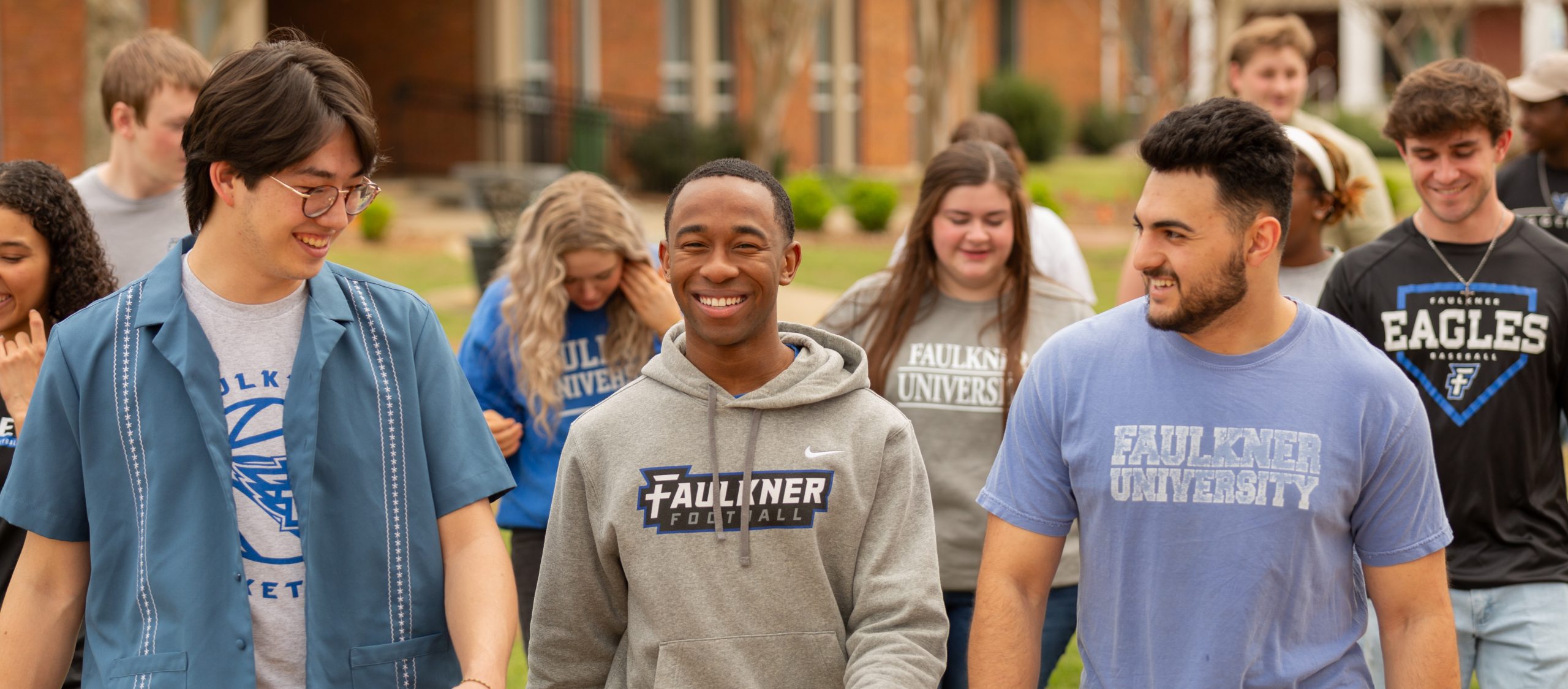 Group of students walking across campus.
