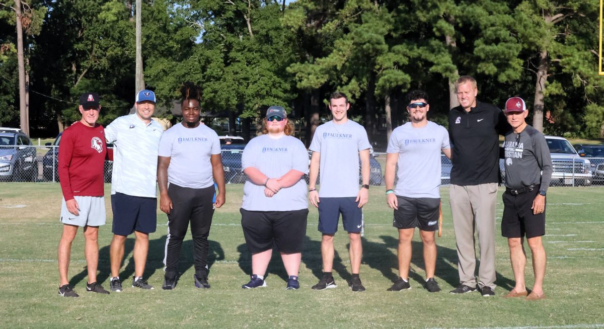 l-r ACA Athletic Advancement Officer Tim Perry, David Woodason, Faulkner students Ja'Veon Kynard, Bryce Hicks, Nicholas Butts, Santos Sanchez, ACA Athletic Director Aaron Greenwood and Director of Football Operations Don Gilliam.