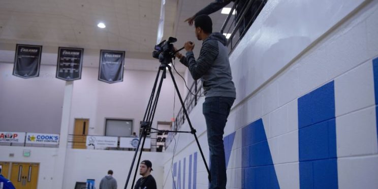 Jacob Hartsfield with the Faulkner Sports Network mans the camera during this season's games while Keavonte' Lindsey assists in the balcony.