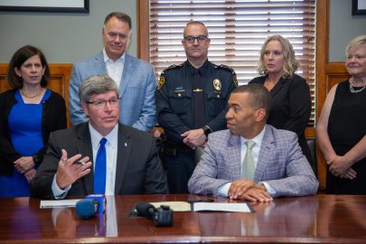 President Mitch Henry speaks at a press conference at City Hall as a partnership is signed between Faulkner and MPD.