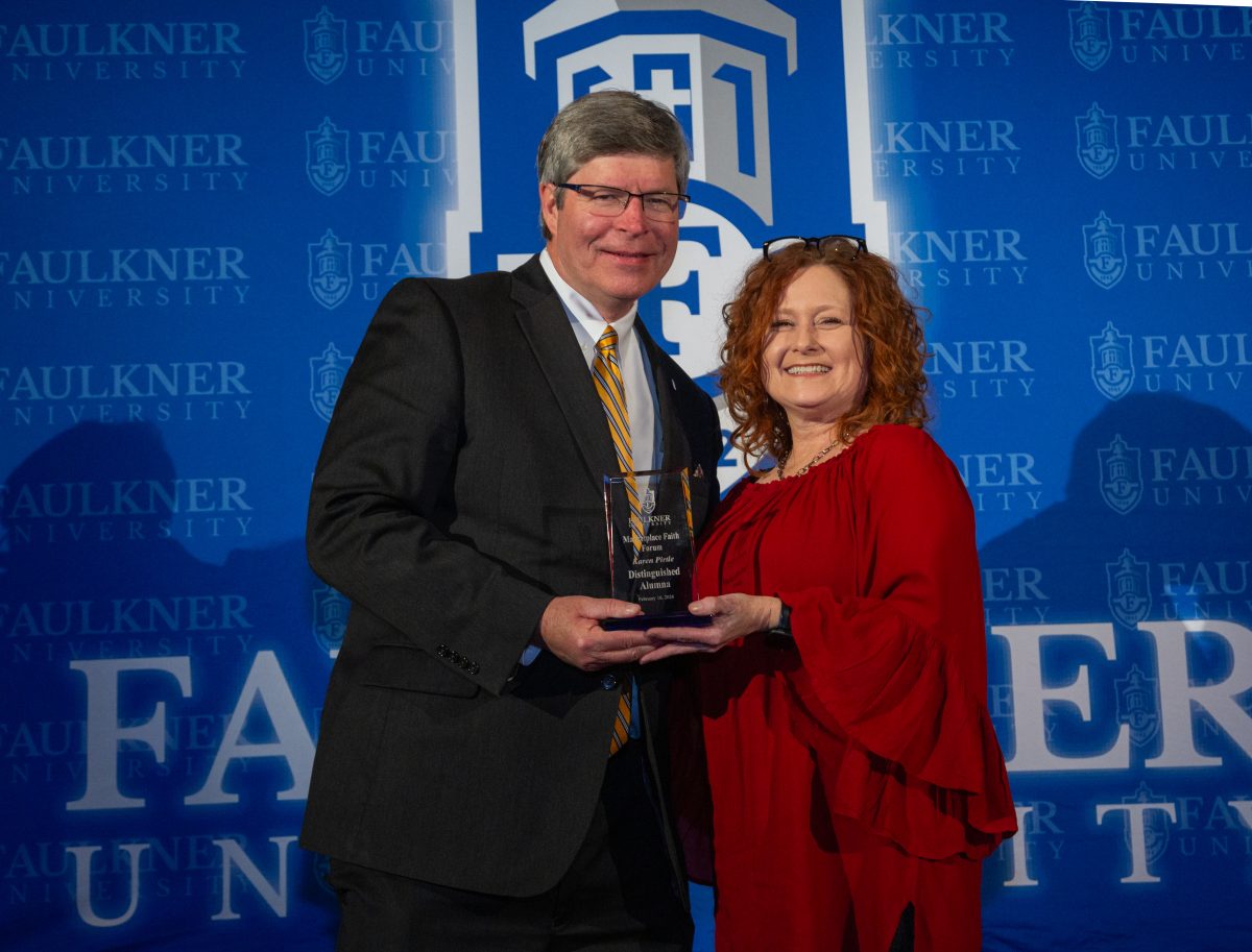 President Mitch Henry awards Karen Pirtle during the 2024 Marketplace Faith Friday Forums.