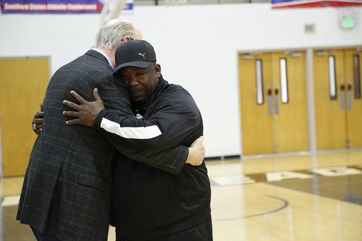 l-r Judge Gene Reese and Alfy Smith embrace during an emotional reunion in Tine Davis Gym.