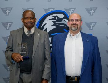 l-r Matthew Conley and Dr. Todd Brenneman pose after Conley was honored during the Marketplace Faith Friday Forums for his service in the classroom and prison ministry.