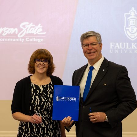 Dr. Danielle Coburn, left, and President Mitch Henry pose for a picture after signing the MOU.